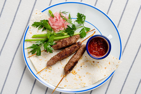 beef kebab with hot sauceの写真素材