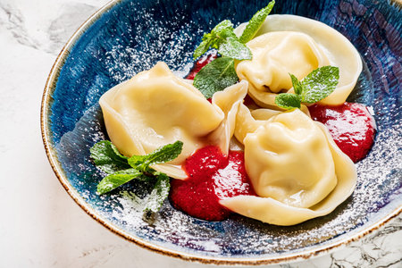 dumplings with cherry and mintの写真素材