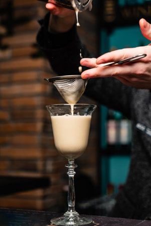 barman making cocktail in the barの写真素材