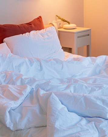 white bedroom with lamp and vaseの写真素材