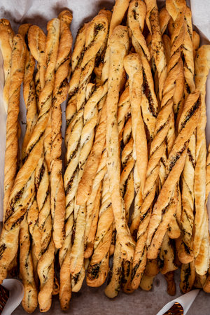 Breadsticks in a basket on a wooden background.の写真素材