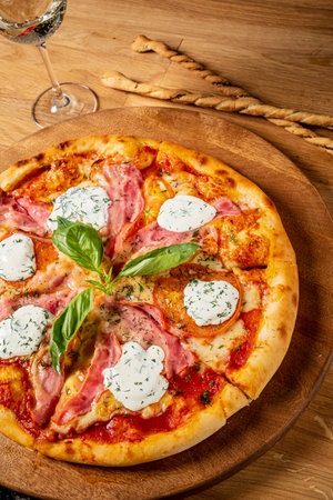pizza with mozzarella on wooden backgroundの写真素材