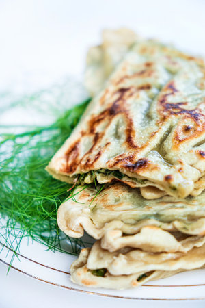 flatbread with fresh herbs macroの写真素材