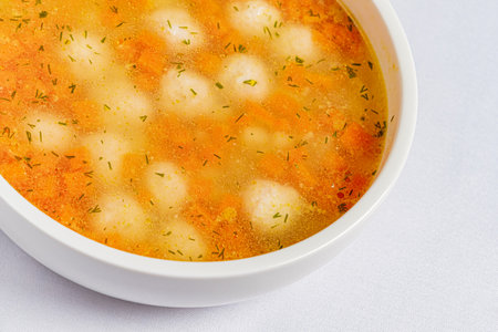 soup with meatballs on white backgroundの写真素材