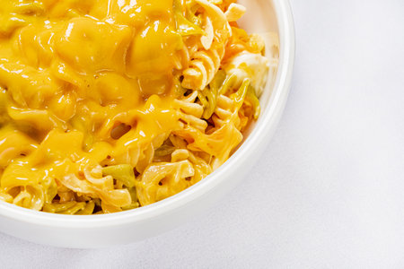 pasta with cheddar on white backgroundの写真素材