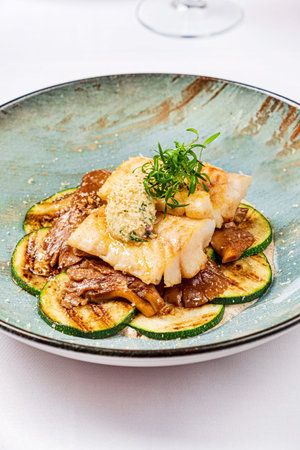 white fish with zucchini and sauce