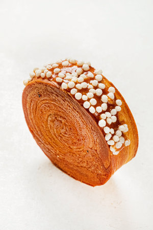 Bread with sesame seeds on a white background, top view