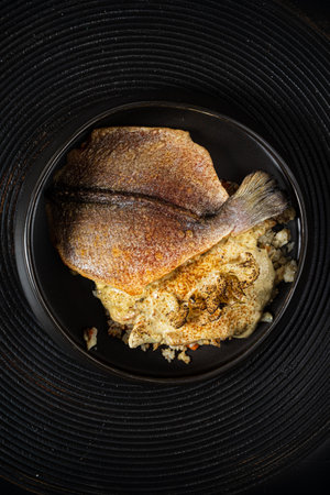 fried flounder with sauce and vegetablesの写真素材