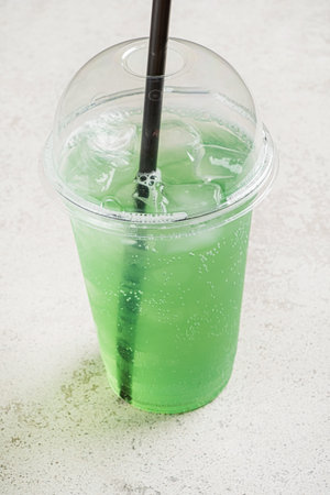green lemonade in the plastic cupの写真素材