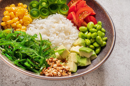 Vegetable salad with rice, avocado, corn and arugula.