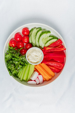 fresh vegetables on the white plateの写真素材