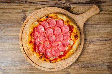 italian pizza on the wooden boardの写真素材