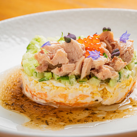 Traditional russian salad Olivier served on wooden tableの写真素材