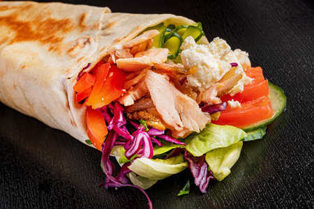 tortilla wrap with meat and vegetablesの写真素材