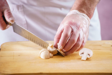 Chef cutting fresh and delicious vegetables for cookingの写真素材
