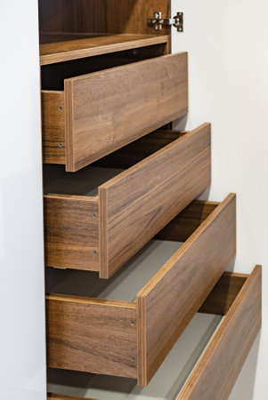 Empty shelves in white wooden rack, close upの写真素材