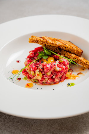 beef tartare with toast and herbsの写真素材