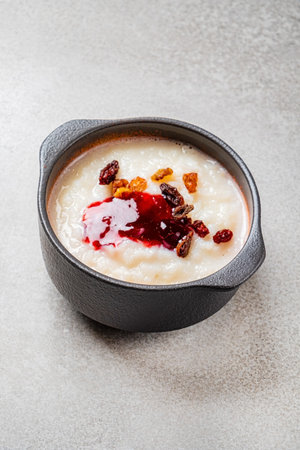 Rice pudding with cinnamon and berriesの写真素材