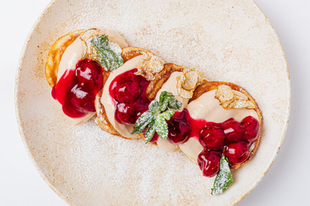 pancakes with cherries and creamの写真素材