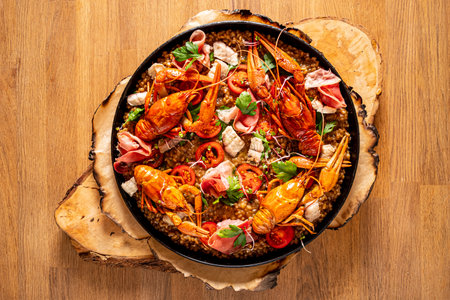 A colorful seafood dish is beautifully presented with vibrant ingredients that invite exploration.の写真素材