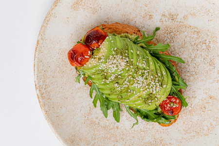 toast with avocado and tomatoesの写真素材