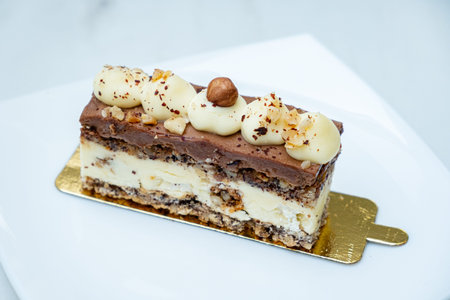 This delightful dessert showcases layers of creamy chocolate and rich flavors, garnished elegantly.