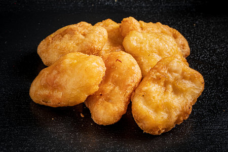 Mouthwatering nuggets glisten with a crispy coating, perfect for sharing at any celebration.の写真素材