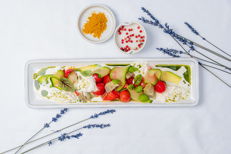 Vibrant fresh vegetables and creamy elements arranged to evoke summer freshness.