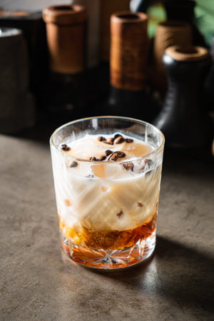 A delicious layered drink of coffee, cream, and sweetness, served artfully.