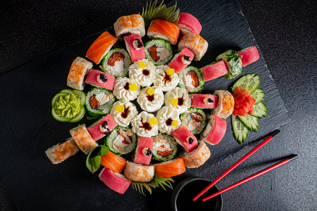 Sushi rolls are artfully arranged with vibrant ingredients for an inviting meal.の写真素材