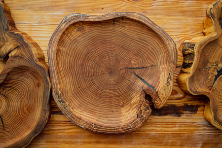 Natural wood platter highlights stunning grain design, perfect for serving or display purposes.の写真素材