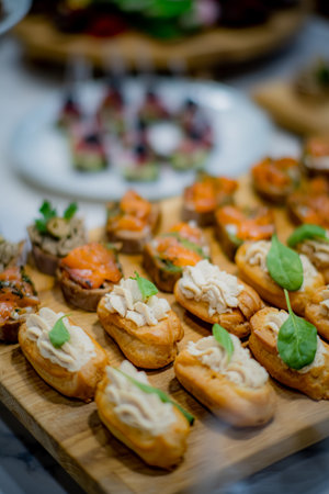 A colorful assortment of gourmet appetizers garnished with fresh herbs, perfect for parties.