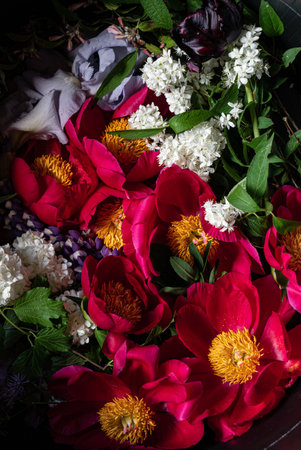 A basket brimming with pink and white flowers showcases spring's natural beauty.の写真素材