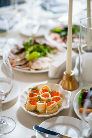 Colorful plates showcase elegant appetizers at a festive gathering, inviting appetites.の写真素材