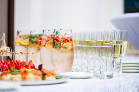 Colorful beverages and delicious treats await guests at this cheerful outdoor gathering.の写真素材