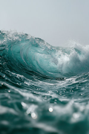 A vibrant wave curls and crashes, showcasing the sea's incredible motion and energy.の素材