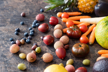 Vibrant fruits and vegetables laid out on a rustic stone table, promoting a sustainable lifestyle.