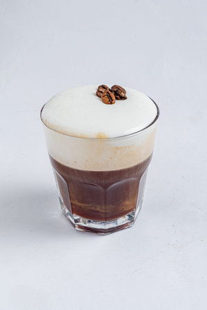 Savor a creamy coffee with rich chocolate layers and a frothy topâ€”perfect for coffee lovers!