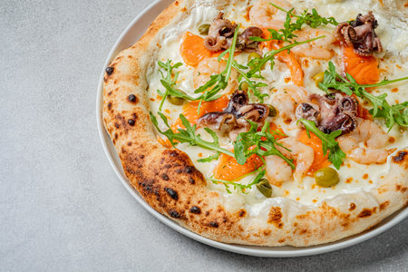 Fresh seafood pizza features shrimp, octopus, and arugula, perfect for a savory meal.の写真素材