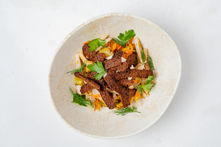 A vivid salad of crisp veggies, crunchy bread, and fresh herbs makes a delightful dish.の写真素材