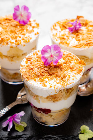 Classic tiramisu dessert in a glass on a dark background.の写真素材