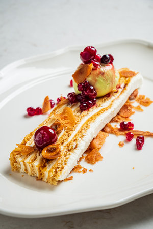 Delicious layers topped with fresh fruits and crispy delights make a perfect treat.の写真素材