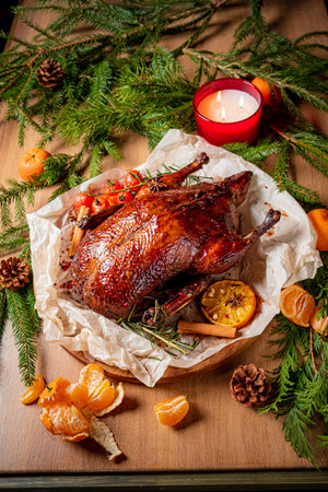 Roast duck with fresh herbs, spices, and citrus creates a festive vibe.の写真素材