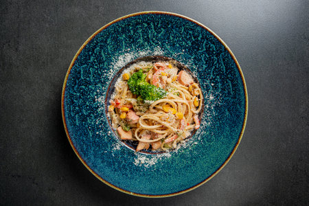 A colorful seafood pasta dish showcases fresh ingredients and intricate flavors, inviting enjoyment.の写真素材