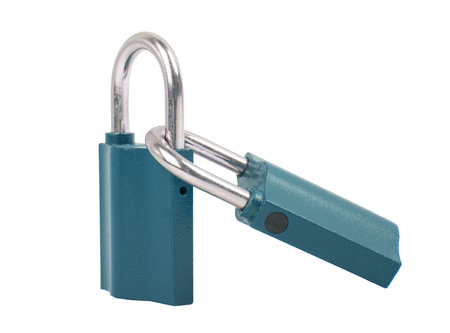 Laced metal padlocks. Two padlocks together over white background.の写真素材