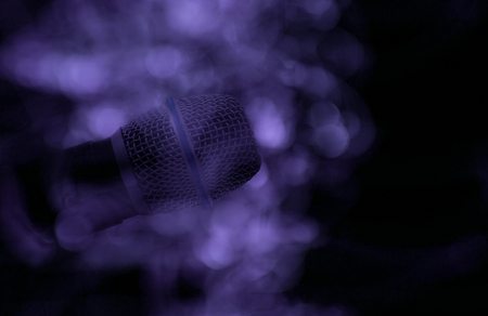 Karaoke party, mic on stage. Microphone on dark background.の写真素材