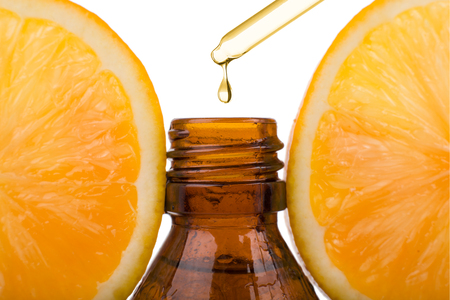 Essential oil with orange - vitamin C. Natural remedies, drop vitamin C - dropper.の写真素材