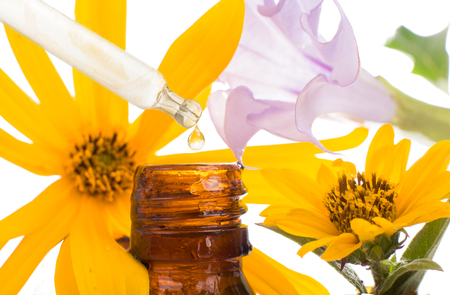 FLORITERAPIA BACHA - natural remedies. Drop falling from pipette of essential oil,の写真素材