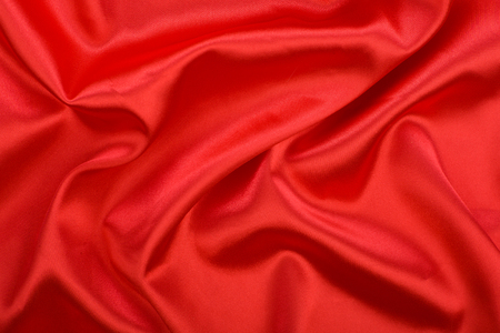 Soft red satin textures. Red silk fabric, background.の写真素材