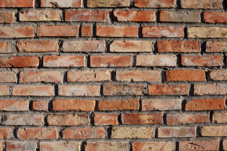 Wall of red brick - structure, bricklayer. Old red brick wall texture background.